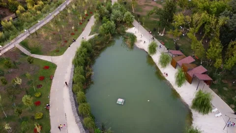 People are walking around the tiny lake Stock Footage 238801995