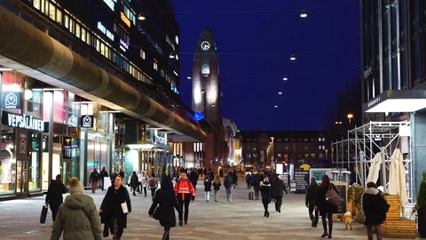 People are walking down the night illuminated street Stock Footage 104110658