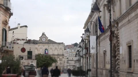 People are walking, flags Matera 2019, street Matera Sassi, cavern, stone city Stock Footage 83705170