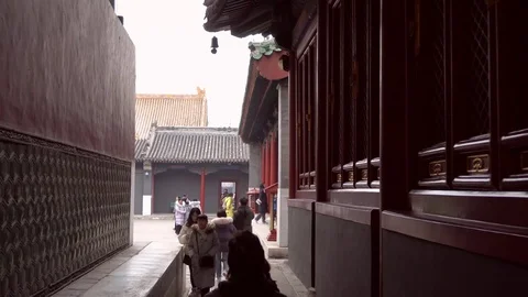 People are wallking between two awesome temple Stock Footage 125275957