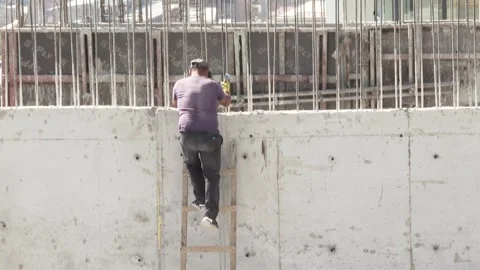 People are working at a construction site  (EDITORIAL) 25 Stock Footage 318949854
