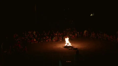 People around the fire spurts of flame   Stock-Footage 44788231