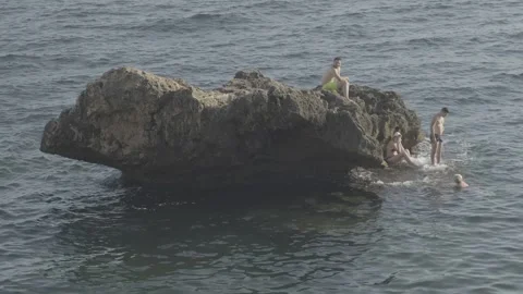 People around the rock Stock Footage 254072077