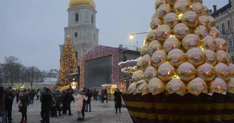 People at The Artificial Tree Made Up Like Sweets Illuminated Carousel Bell Stock Footage 58734997