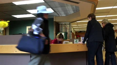 People asking direction at guest services counter Video stock 68362175