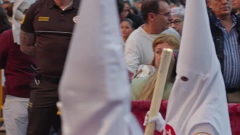 People attending a Holy Week procession in Spain 스톡 동영상 333957209