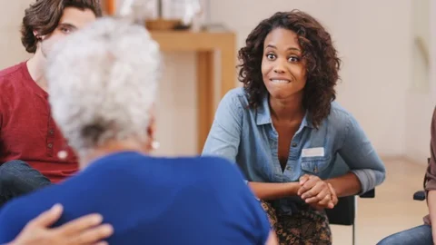People Attending Self Help Therapy Group Meeting In Community Center Stock Footage 111912592