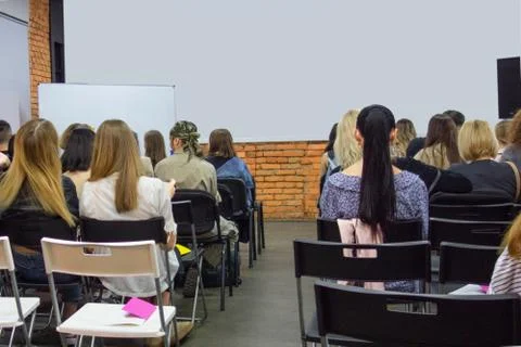 People in auditory during presentation or seminar. Teenagers or young men and 스톡 사진