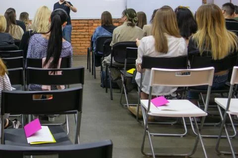 People in auditory during presentation or seminar. Teenagers or young men and 스톡 사진