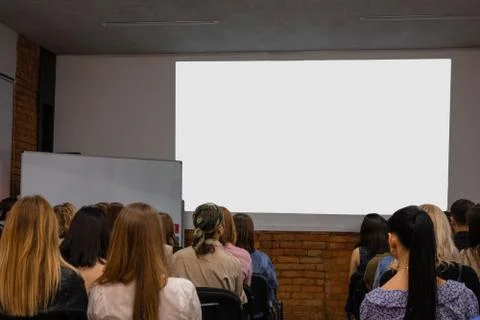 People in auditory during presentation or seminar. Teenagers or young men and 스톡 사진