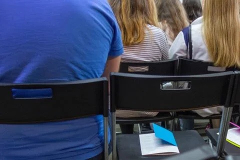 People in auditory during presentation or seminar. Teenagers or young men and 写真素材