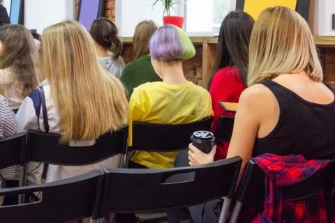 People in auditory during presentation or seminar. Teenagers or young women a 스톡 사진