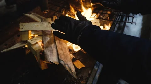 People bask near the fire Stock Footage 101333157