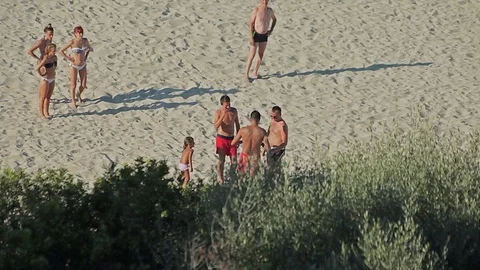 People bathe and rest on the beach. Spanish beaches in Cala Mendia. Mallorca Stock Footage 75553389