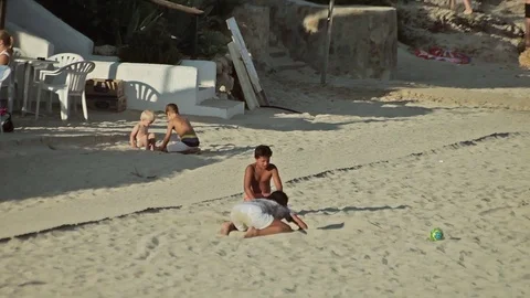 People bathe and rest on the beach. Spanish beaches in Cala Mendia. Mallorca Stock Footage 75590870