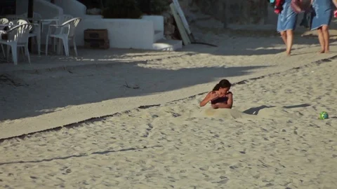 People bathe and rest on the beach. Spanish beaches in Cala Mendia. Mallorca Видео 75592618