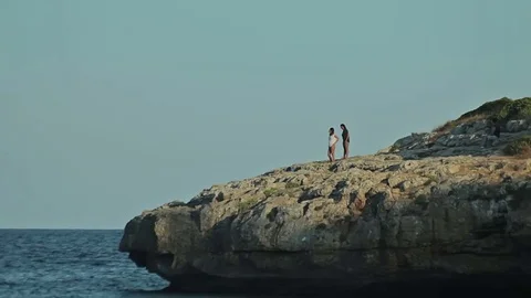 People bathe and rest on the beach. Spanish beaches in Cala Mendia. Mallorca Stock Footage 75594900