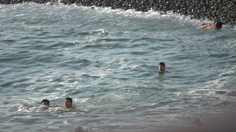 People bathe in the waves of the ocean. Stock Footage 125193205