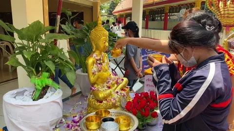 People bathing a Buddha image during Songkran, Pattaya city, Thailand 4K Stock Footage 179869975