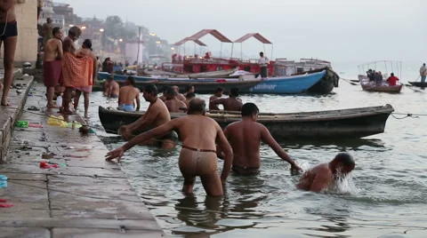 People bathing on the ghats of Ganges river in Varanasi. Stock Footage 50409466
