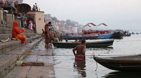 People bathing on the ghats of Ganges river in Varanasi. Stock Footage 50409500