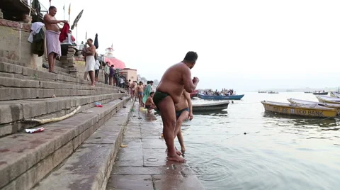People bathing on the ghats of Ganges river in Varanasi. Stock Footage 50410186