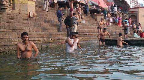 People bathing on the ghats of Ganges river in Varanasi. Stock Footage 50413550