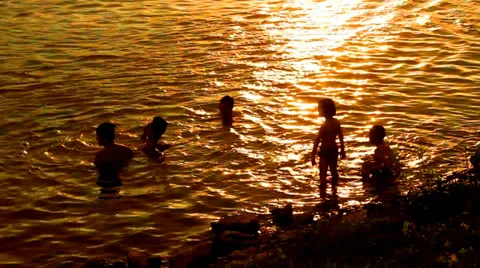 People bathing in the river at sunset Stock Footage 39442265