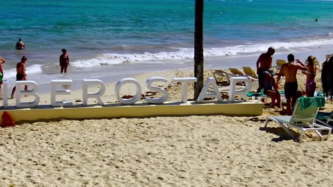 People at Bavaro Beach at Punta Cana in Dominican Republic. Stock Footage 233295437