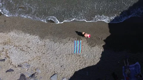 People at the beach aerial drone view playing enjoying holidays at the shore Stock Footage 244942111