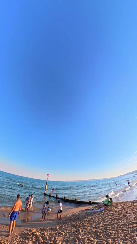 People at Beach of Bournemouth Sandy Beach England Видео 342514657