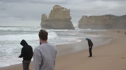 People On A Beach On A Cold Windy Day In The Great Ocean Road Victoria Australia Stock Footage 231590122