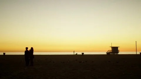 People on beach at the dawn Stock Footage 77575500