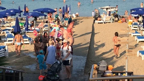 People At The Beach. Fig Tree Beach, Cyprus Stock Footage 121670566