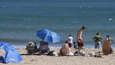 People on beach Stock Footage
