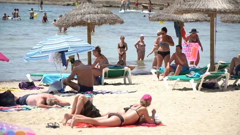 People at the beach Stock Footage 128349202