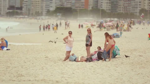 People on the beach in Rio Stock Footage 62334995