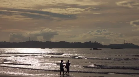 People at the beach sunrise Stock Footage 58317209
