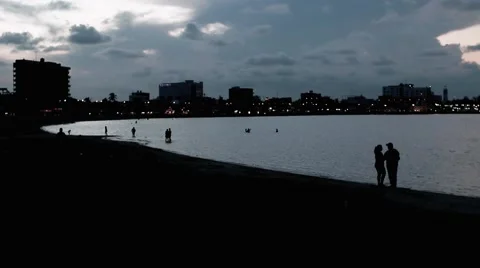 People on the beach at sunset Video stock 67649068