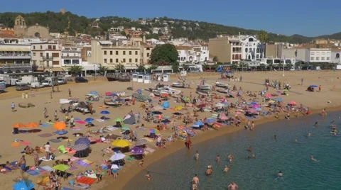 People at the beach in Tossa de Mar, Spain Stock Footage 67398638