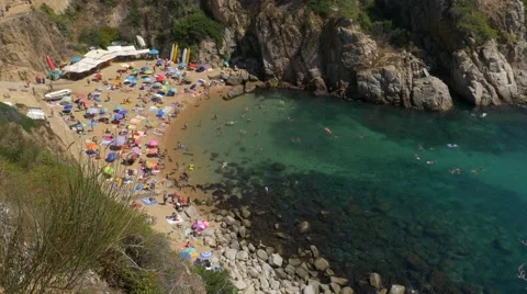 People at the beach in Tossa de Mar, Spain Stock Footage 67455500