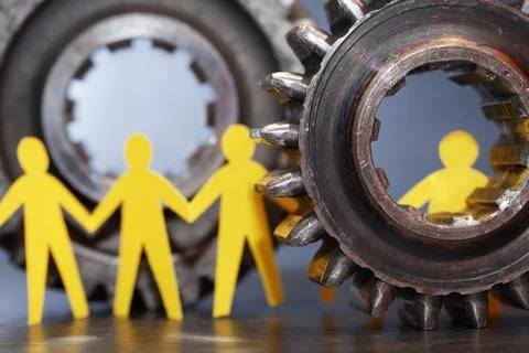 People Between Gears Stock Photos