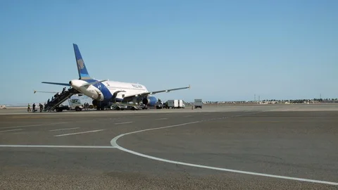 People Board The Plane In Egypt, Long Shot, Clean Airfield Stock Footage 91803564