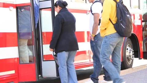 People boarding bus 1 Stock Footage 1056772