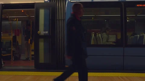 People boarding a modern blue train at the subway station Stock Footage 329592865