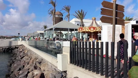 People on boardwalk on harbor front Stock Footage 84756583