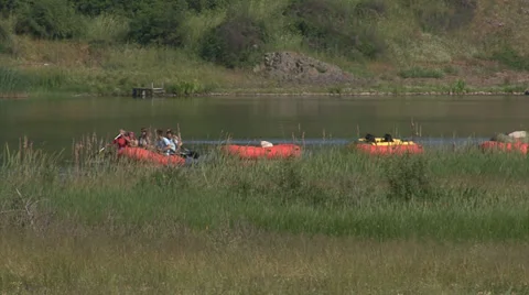 People boating with a boat in a river, riverside Stock Footage 39842575