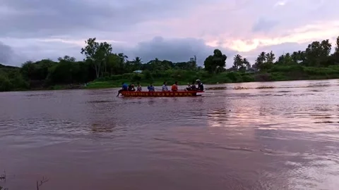 People boating on Krishna river during evening sunset and during flood. Stock Footage 138321741