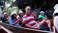 People in boats at the floating market near Bangkok in Thailand HD Footage