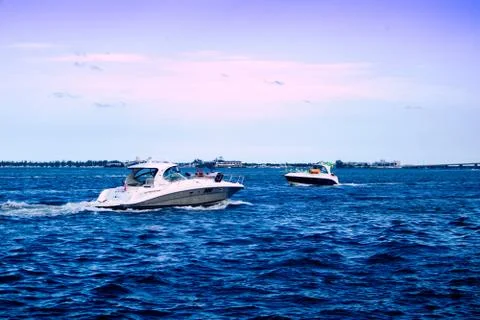 People on boats in the Miami South Channel near the coast of Brickell Key in  Stock Photos